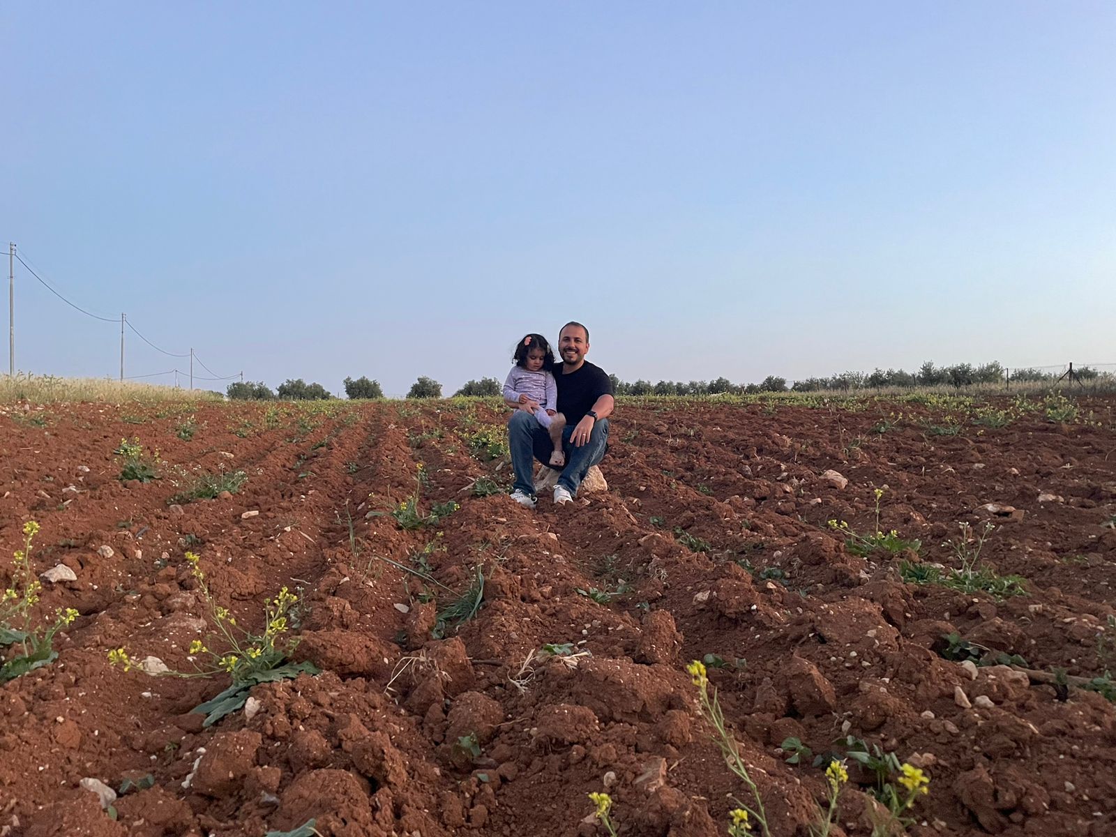 Father and child in a field
